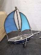 Pair of metal and glass sailboat figures. 2d