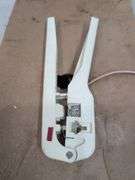 Leviton quad station wire, beige, wire stripper. 3a