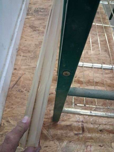Green and gold metal shelf
