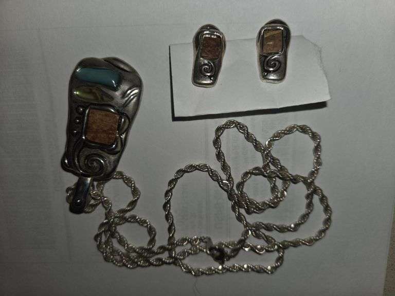 Silver chain, pendant, matching earings.