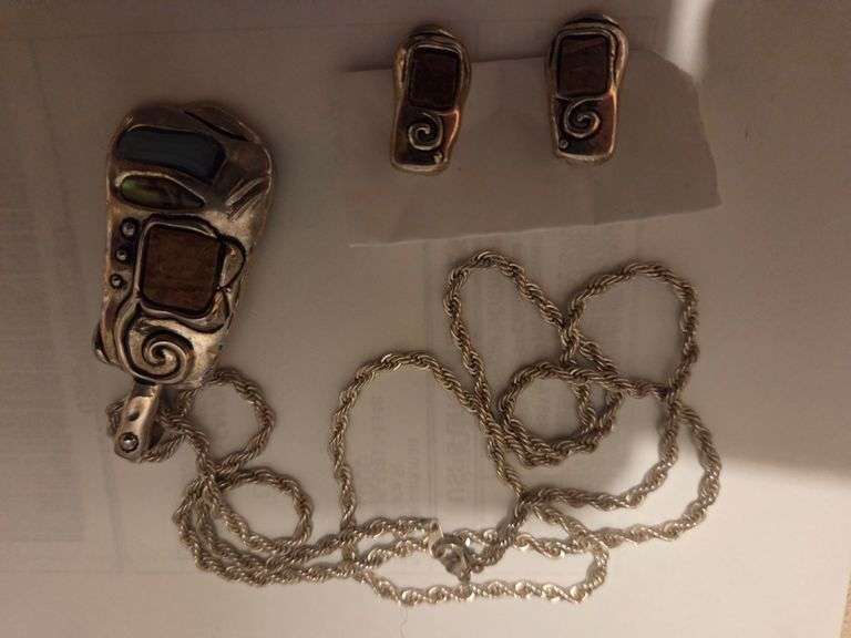 Silver chain, pendant, matching earings.