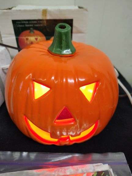 2 Lighted pumpkins and The Good Witch figurene & door cover