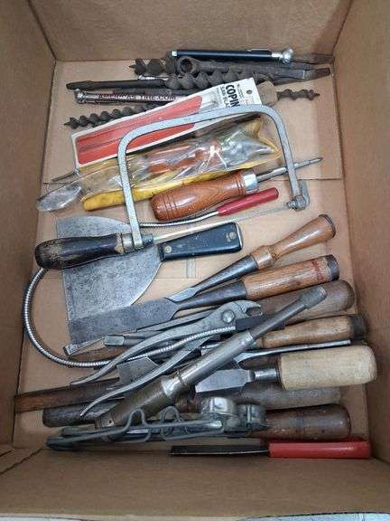 Box lot tools: chisels, saw blades, bits, and more. 2d