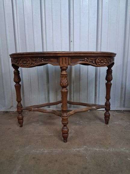 Small oval carved wood table