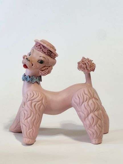 Pink spaghetti poodle with red striped hat