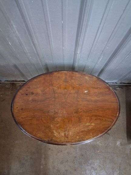 Small oval carved wood table