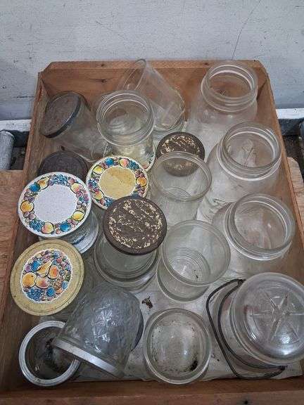 Vintage wooden CA grapes crate full of a variety of glass jars. 1e