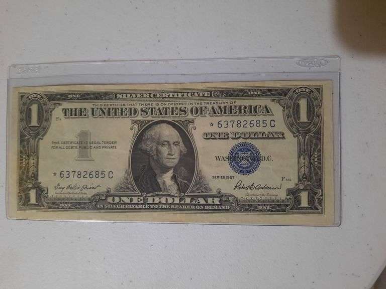 Star Note 1957 $1 Silver certificate in plastic holder
