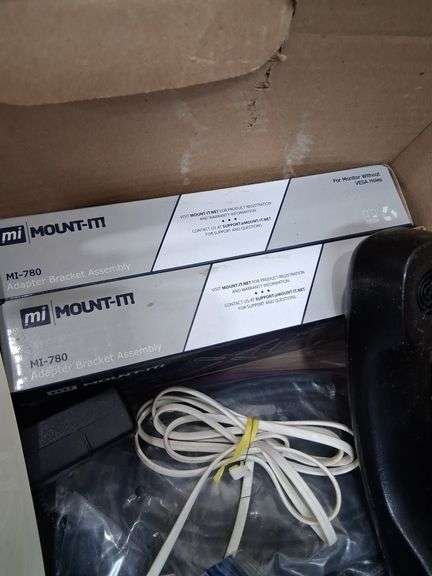 Box lot: home tech with alarm clock, cords, mini camera, and more. 2e