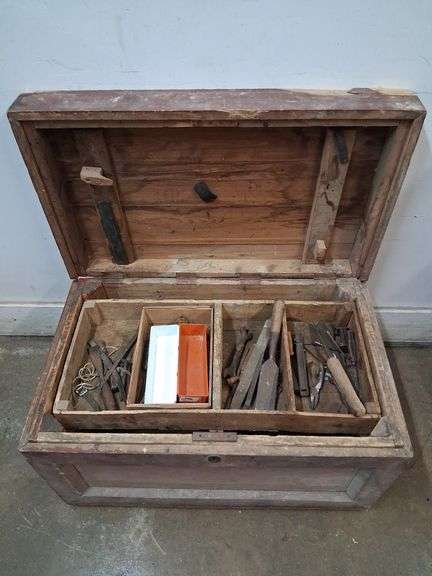 Wooden tool trunk with contents