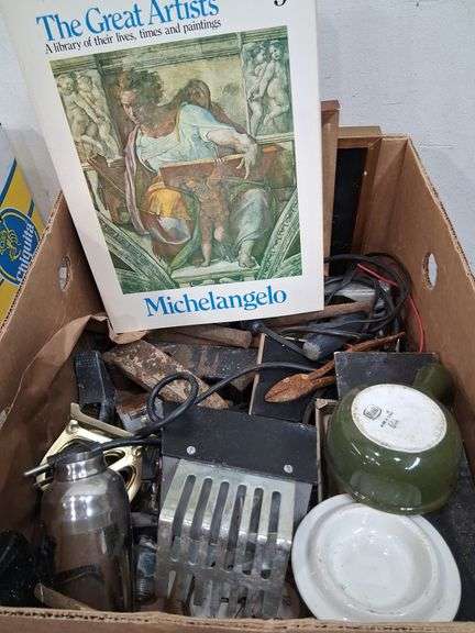 Box lot: Artists books, frames, cast iron pieces, and more. 11b