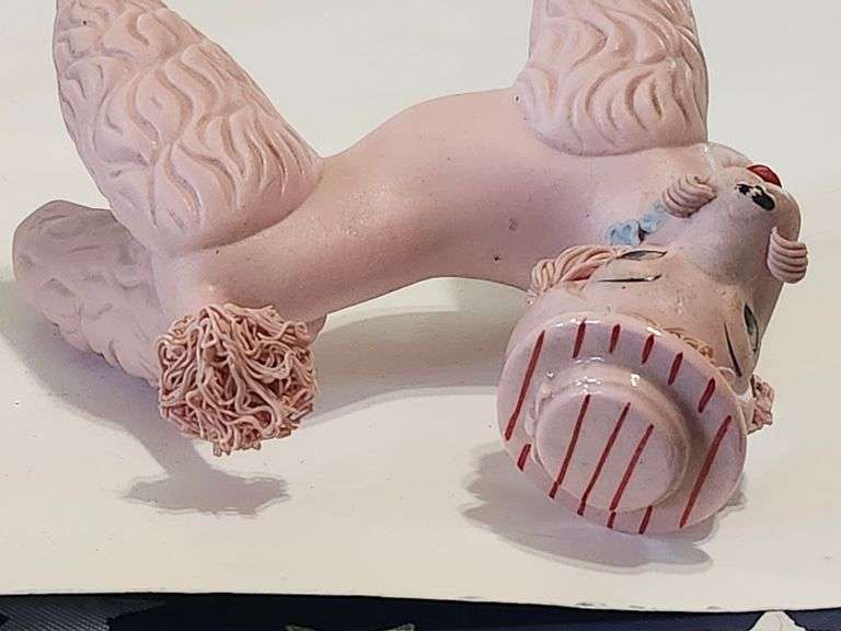 Pink spaghetti poodle with red striped hat