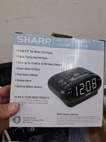 Box lot: home tech with alarm clock, cords, mini camera, and more. 2e