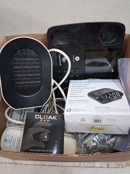 Box lot: home tech with alarm clock, cords, mini camera, and more. 2e