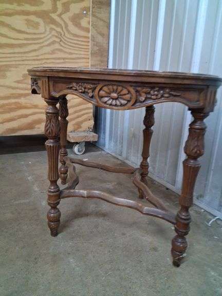 Small oval carved wood table