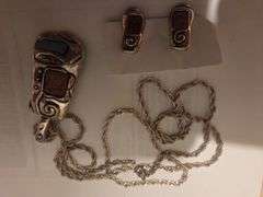 Silver chain, pendant, matching earings.