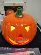 2 Lighted pumpkins and The Good Witch figurene & door cover