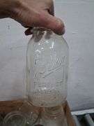Vintage wooden CA grapes crate full of a variety of glass jars. 1e