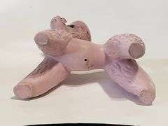 Pink spaghetti poodle with red striped hat