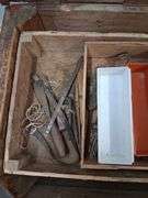 Wooden tool trunk with contents