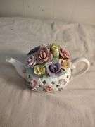 Telephone and teapot music box figurines