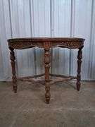Small oval carved wood table