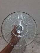 Clear glass cake stand and small tray/plate variety. 1c