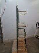 Green and gold metal shelf