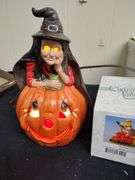 2 Lighted pumpkins and The Good Witch figurene & door cover
