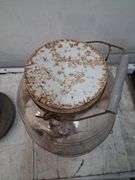 Large glass jar full of shells. 1c