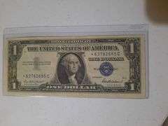 Star Note 1957 $1 Silver certificate in plastic holder