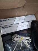 Box lot: home tech with alarm clock, cords, mini camera, and more. 2e