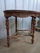 Small oval carved wood table