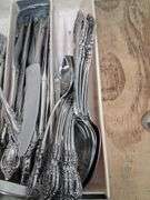 Cutlery organizer full of Oneida community forks/spoons/ knives. 3c