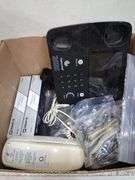 Box lot: home tech with alarm clock, cords, mini camera, and more. 2e