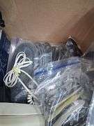 Box lot: home tech with alarm clock, cords, mini camera, and more. 2e