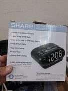 Box lot: home tech with alarm clock, cords, mini camera, and more. 2e