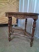 Small oval carved wood table