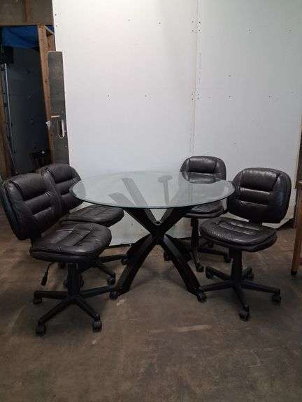 Modern round glass top table and 4 rolling chairs
