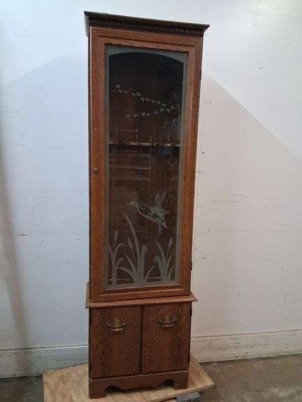 Gun cabinet with geese decor
