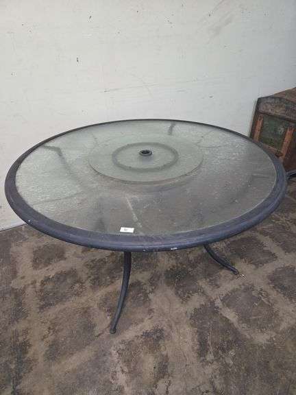 Large round outdoor table with umbrella holder middle