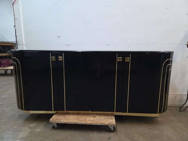 Black cabinet with 2 doors and shelving, gold accents