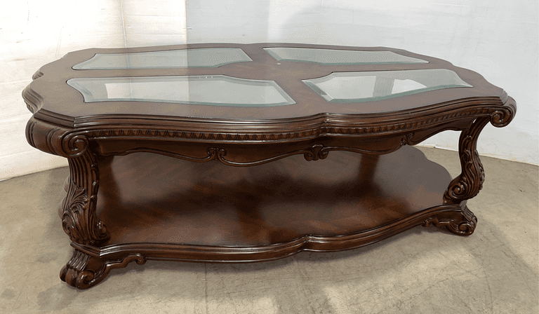 Dark wooden ornate coffee table, 55"W x 34"D x 19"H, wobbly