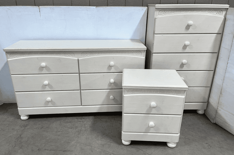 (3) Piece bedroom set in white, includes: Nightstand, 21"W x 16"D x 26"H; Tall dresser, 28"W x 16"D x 49"H; Long dresser, 56"W x 16"D x 33 1/2"H, some nicks and edge rubs