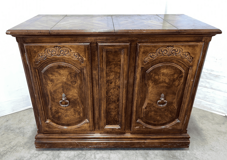 Dry bar unit, inlaid top has two flip out panels for black work surface, pullout shelves behind doors, on wheels, 43"W x 20"D x 33"H, some edge rubs