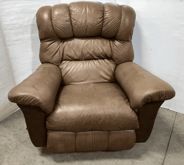 Brown La-Z-Boy recliner, sits and reclines well, seat- 25"W x 21"H, has some scratches, marks, and rips