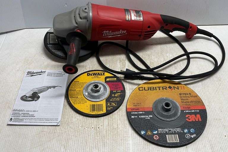 Heavy duty Milwaukee 7/9" grinder with (3) grinding wheels and manual