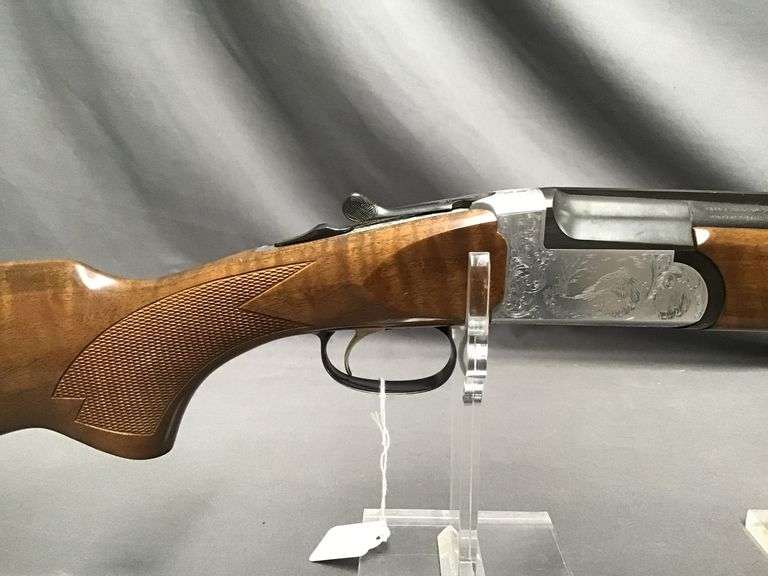 Traditions 28-gauge over/under shotgun with engraved pheasant scene ...