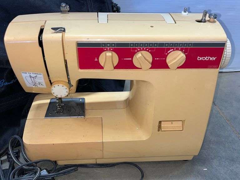 Brother VX1100 sewing machine with pedal in an Eddie Bauer travel bag Albrecht Auction Service