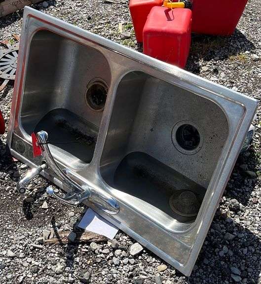 Two basin kitchen sink with insinkerator septic disposal unit, unit is